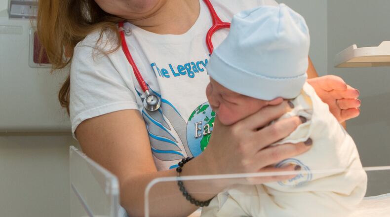Hanan Waite burps a newborn baby at the Northside Hospital Women’s Center in Atlanta on Wednesday March 15, 2017.