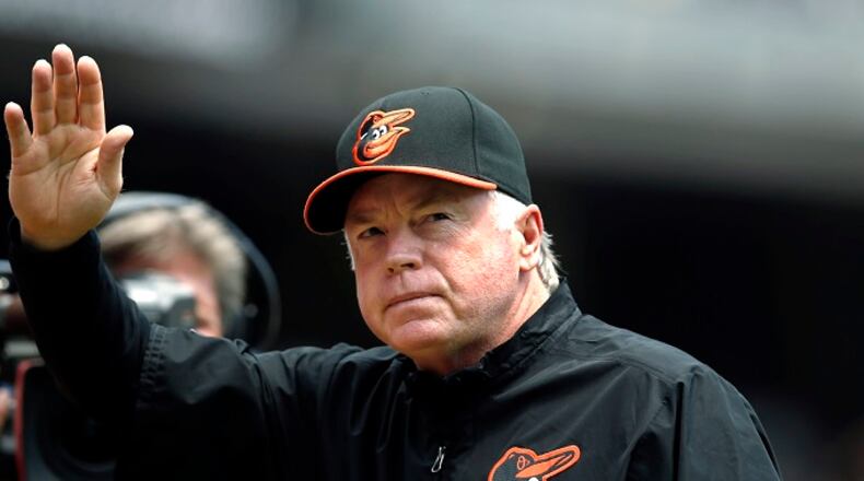 In this June 22, 2014, file photo, Baltimore Orioles manager Buck Showalter waves to the crowd during introductions for the Yankees' Old Timers' Day before an Orioles baseball game against the New York Yankees at Yankee Stadium in New York. Showalter was chosen AL Manager of the Year on Tuesday, Nov. 11. (AP Photo/Kathy Willens, File)