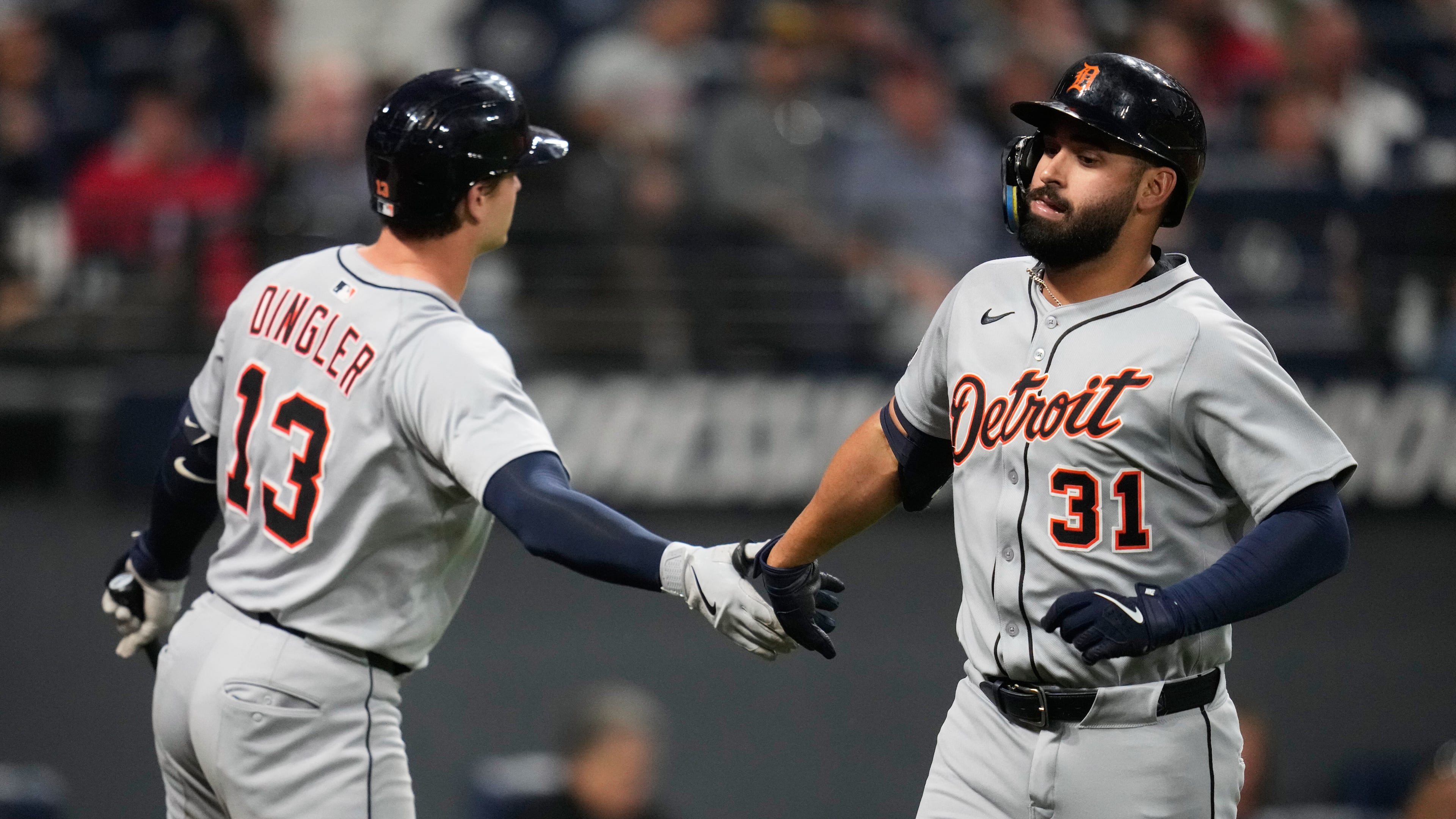 Detroit Tigers' Riley Greene (31) is congratulated by Dillon Dingler (13) after hitting a home run in the fourth inning of a baseball game against the Cleveland Guardians in Cleveland, Thursday, Sept. 25, 2025. (AP Photo/Sue Ogrocki)