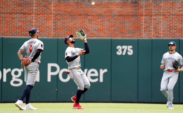 Minnesota Twins outfielder Byron Buxton (25) makes a catch for an out off of Atlanta Braves' Ozzie Albies, not pictured, during the third inning of a baseball game Saturday, April 20, 2025, in Atlanta. (AP Photo/John David Mercer)