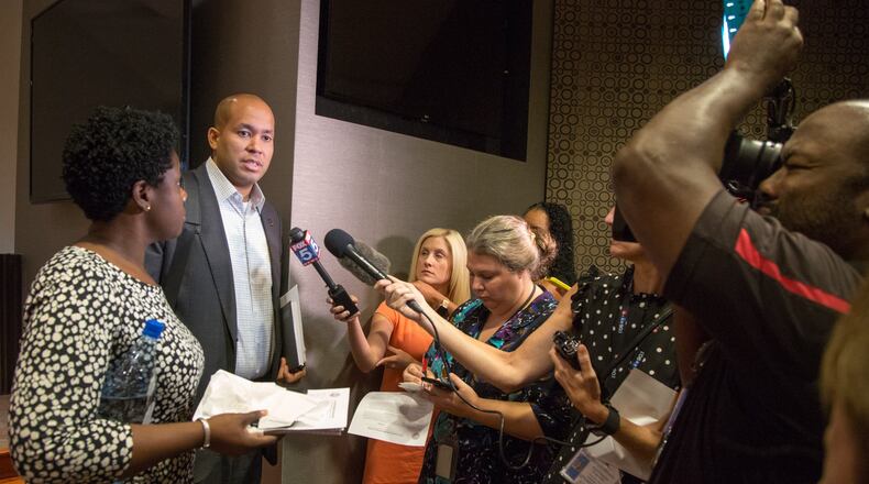 Atlanta school board vice chair Eshe’ Collins (left) and board chairman Jason Esteves talk to the media and parents after they announced that the board would not extend superintendent Meria Carstarphen’s contract, during a special meeting at the APS headquarters in downtown Atlanta on Monday, Sept. 9, 2019. (Photo by Phil Skinner).