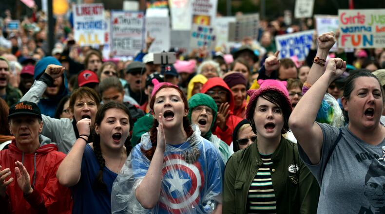 Marchers respond to speakers at the Center for Civil and Human Rights before the start of the Women’s March in Atlanta the day after the inauguration of President Donald Trump. Trump’s election has sparked a level of political activism not seen in Georgia since the early days of the conservative tea party. Opponents of the president’s policies have marched in the streets of the state’s biggest cities, channeled an avalanche of phone calls to GOP lawmakers and held a spate of town halls to try to channel that anger into activity. (DAVID BARNES / DAVID.BARNES@AJC.COM)