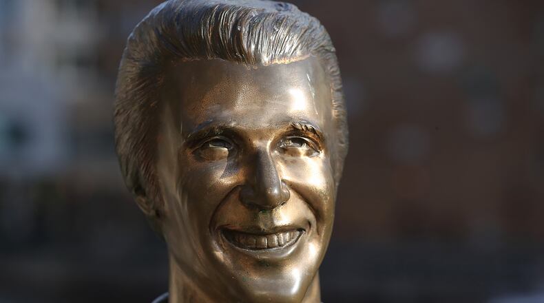 The Bronze Fonz, a public artwork by American artist Gerald Sawyer located on the Milwaukee Riverwalk, is the equivalent to the Big Chicken in Marietta seen on Tuesday, Jun 22, 2021, in Milwaukee. The Bronze Fonz depicts Henry Winkler as "The Fonz," a character in the 1970s television show Happy Days, which was set in Milwaukee. Curtis Compton / Curtis.Compton@ajc.com