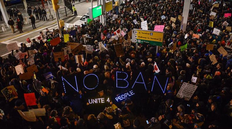 NEW YORK, NY - JANUARY 28: Protestors rally  during a demonstration against the Muslim immigration ban at John F. Kennedy International Airport on January 28, 2017 in New York City. President Trump signed the controversial executive order that halted refugees and residents from predominantly Muslim countries from entering the United States. (Photo by Stephanie Keith/Getty Images)