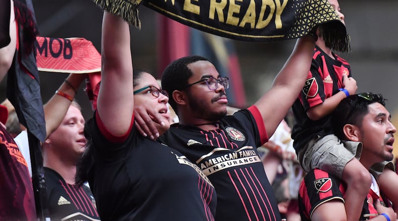 September 10, 2021 Atlanta - Atlanta United fans cheer for their team during the first half in a MLS soccer match at Mercedes-Benz Stadium in Atlanta on Friday, September 10, 2021. (Hyosub Shin / Hyosub.Shin@ajc.com)