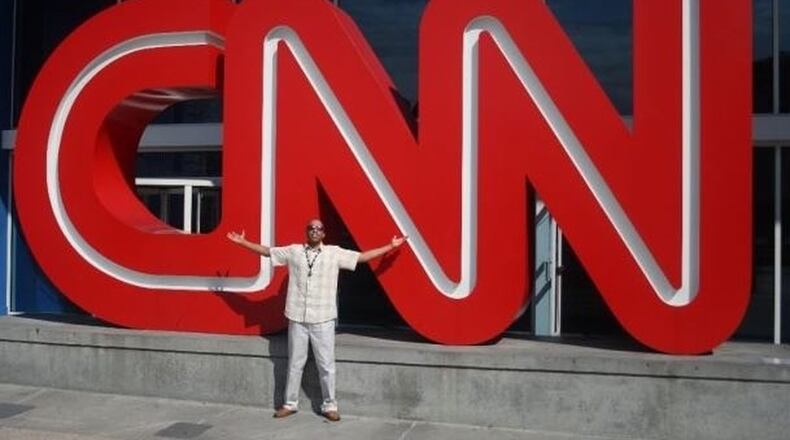 Omar Butcher poses in front of the CNN building in Atlanta on his first day at the network as an associate producer. Butcher, who said he dreamed of working at the network while growing up, was fired after complaining about racially insensitive comments by a popular anchor. (Photo: Contributed)