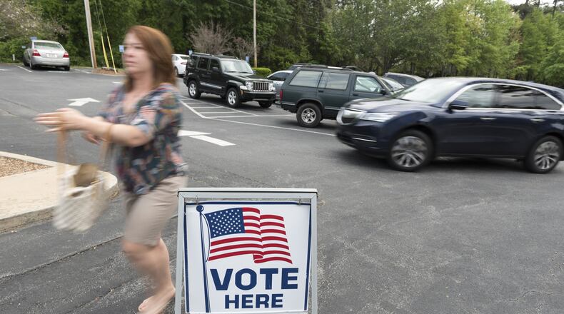 A voter walks into Mount Zion United Methodist Church in Marietta on April 18 to vote in the first round of the 6th Congressional District race. (DAVID BARNES / DAVID.BARNES@AJC.COM)