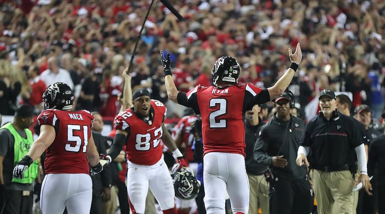 January 14, 2017, Atlanta: Falcons quarterback Matt Ryan plays the crowd urging them to cheering after tossing a touchdown pass to wide receiver Mohamed Sanu for a 36-13 lead over the Seahawks during the fourth quarter in a NFL football NFC divisional playoff game on Saturday, Jan. 14, 2017, in Atlanta. The Falcons beat the Seahawks 36-20. Curtis Compton/ccompton@ajc.com