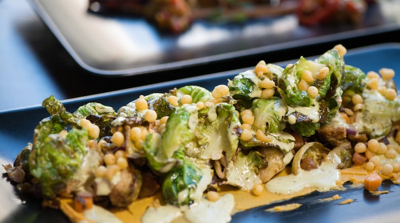 Brussels sprouts “bhel” with garbanzo, sweet potato, tomato, boondi, and tamarind. Photo credit- Mia Yakel.
