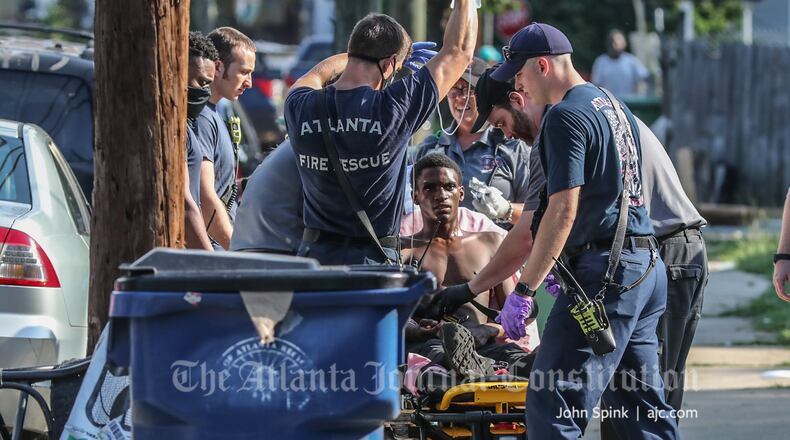 The wounded man, whose name was not released, was expected to be booked into the Fulton County Jail on a battery charge after he was released from a hospital.