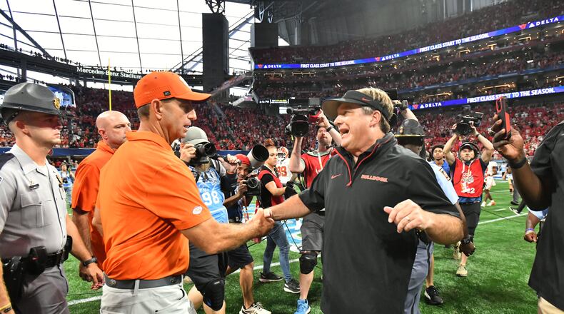 Georgia head coach Kirby Smart and Clemson head coach Dabo Swinney shake hands after Georgia beat Clemson during an NCAA football game at Mercedes-Benz Stadium, Saturday, August 31, 2024, in Atlanta. Georgia won 34-3 over Clemson. (Hyosub Shin / AJC)
