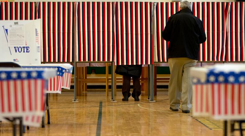 People cast their votes in the presidential primary at Windham High School in Windham, N.H., on Tuesday. AP/Jacquelyn Martin