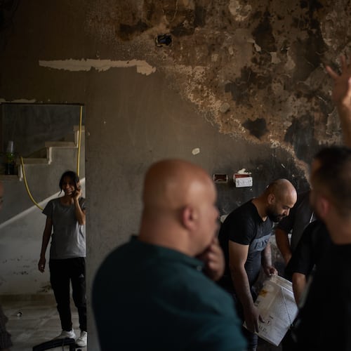 Palestinians gather to repair a damaged house following an attack by Israeli settlers the previous day in the village of Sarra, near the West Bank city of Nablus, Saturday, July 25, 2026. (AP Photo/Leo Correa)