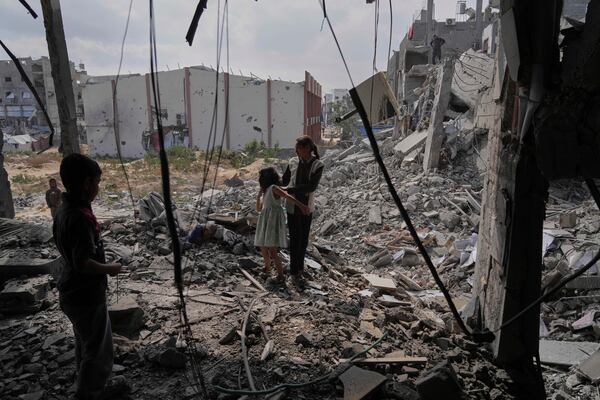 Palestinians look at the damage after an Israeli army airstrike in Beit Lahia, northern Gaza Strip, Monday, April 28, 2025. (AP Photo/Jehad Alshrafi)