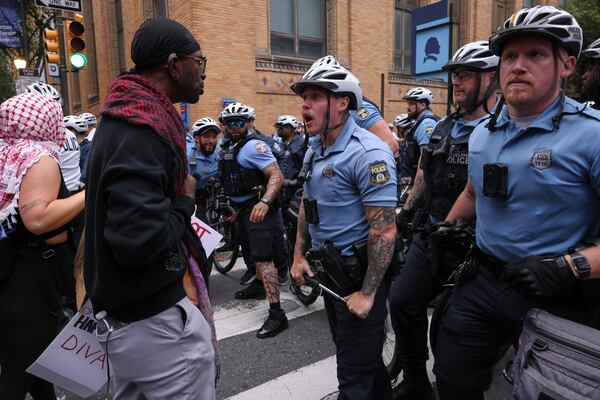 Protestors confront police officers during a protest, Saturday, June 14, 2025, in Philadelphia. (AP Photo/Yuki Iwamura)