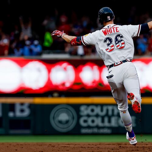 Atlanta Braves' Eli White reacts while rounding the bases after hitting solo home run against the New York Mets during the second inning of a baseball game, Saturday, July 4, 2026, in Atlanta. (AP Photo/Erik S. Lesser)