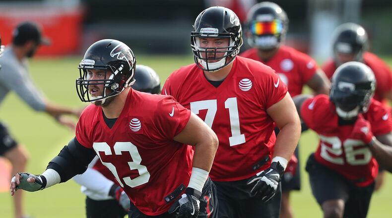 Offensive linemen Ben Garland (63) and Wes Schweitzer (71) battled for the starting right guard position throughout the exhibition season. Curtis Compton/ccompton@ajc.com