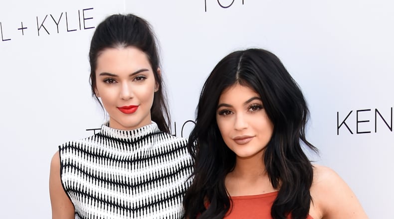 LOS ANGELES, CA - JUNE 03: Kendall Jenner (L) and Kylie Jenner attend a launch party for their Kendall + Kylie fashion line at TopShop on June 3, 2015 in Los Angeles, California. (Photo by Jason Merritt/Getty Images)