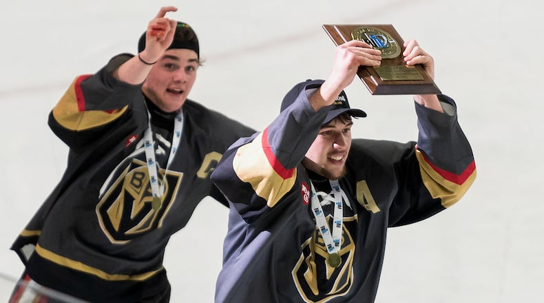 Blackstone Valley Schools team captain Colin Dorgan holds up the Rhode Island Division II state ice hockey championship trophy after defeating Lincoln High School, March 18, 2026, in Providence, R.I. (T.J. Auclair & Kyle Auclair/Little Big Leaguers Photography via AP)