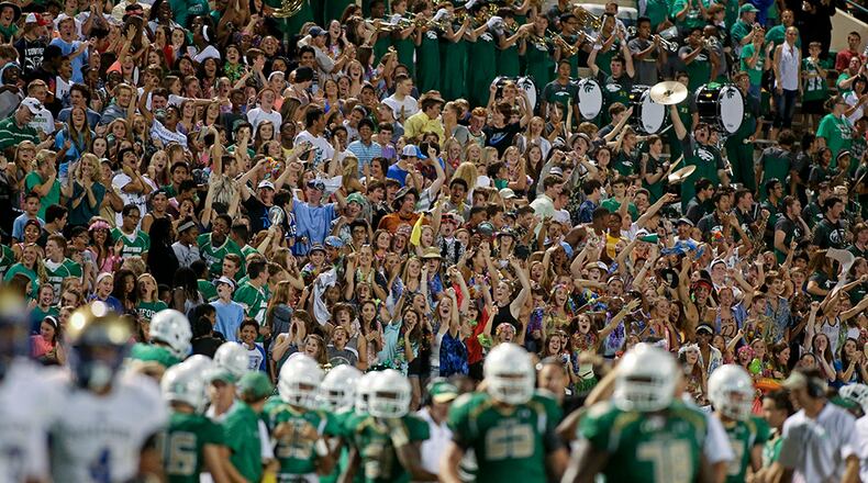 Buford fans celebrate the 27-20 win over McEachern last season in Buford. (Jason Getz / Special to AJC)