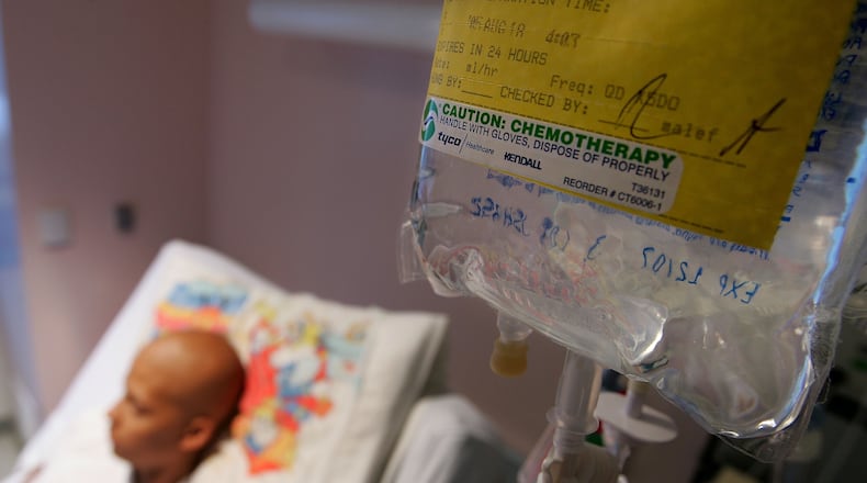 A cancer patient receives chemotherapy treatment, but for a family in the United Kingdom, chemo could not save their mother and father, who died just days apart, leaving three children behind.