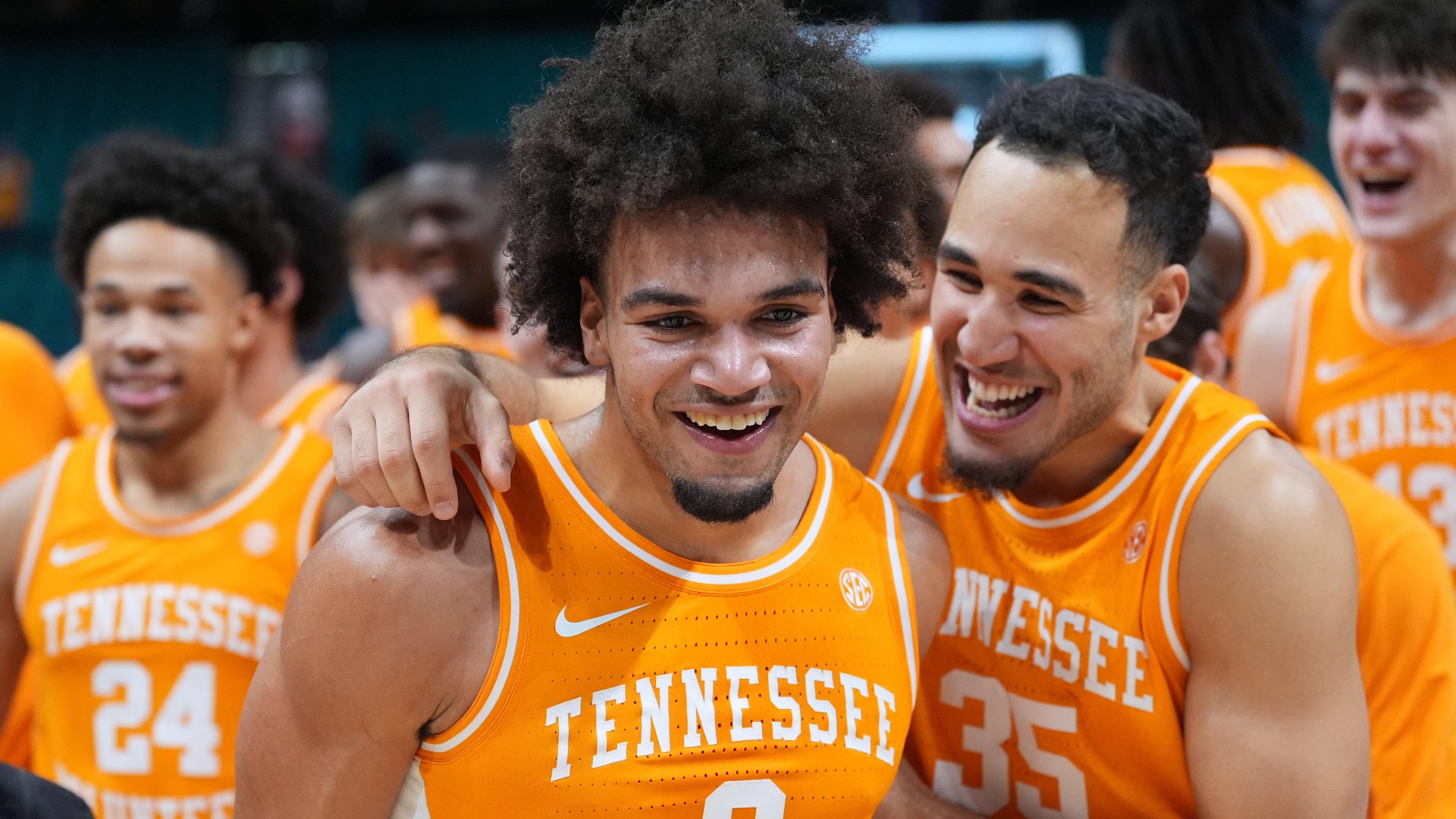 Tennessee guard Ja'Kobi Gillespie (0) and guard Ethan Burg (35) celebrate after Tennessee defeated Houston in an NCAA college basketball game in the Players Era tournament Las Vegas, Tuesday, Nov. 25, 2025. (AP Photo/Eric Gay)