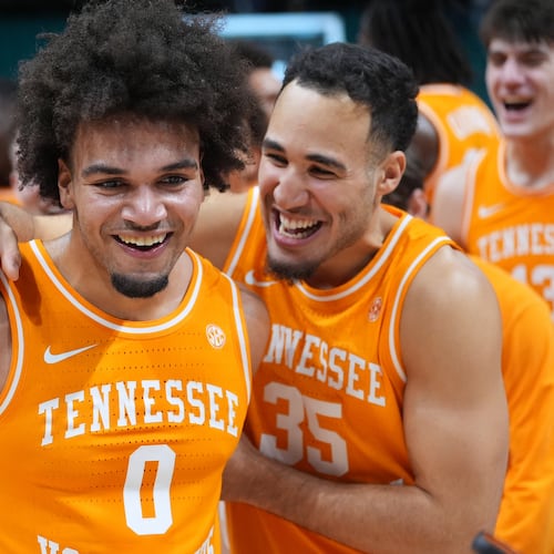 Tennessee guard Ja'Kobi Gillespie (0) and guard Ethan Burg (35) celebrate after Tennessee defeated Houston in an NCAA college basketball game in the Players Era tournament Las Vegas, Tuesday, Nov. 25, 2025. (AP Photo/Eric Gay)