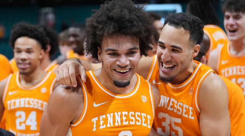 Tennessee guard Ja'Kobi Gillespie (0) and guard Ethan Burg (35) celebrate after Tennessee defeated Houston in an NCAA college basketball game in the Players Era tournament Las Vegas, Tuesday, Nov. 25, 2025. (AP Photo/Eric Gay)
