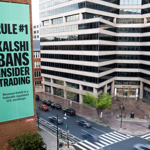 FILE - An advertisement for prediction market platform Kalshi hangs at 13th and L Streets in northwest Washington, April 1, 2026. (AP Photo/Allison Robbert, File)