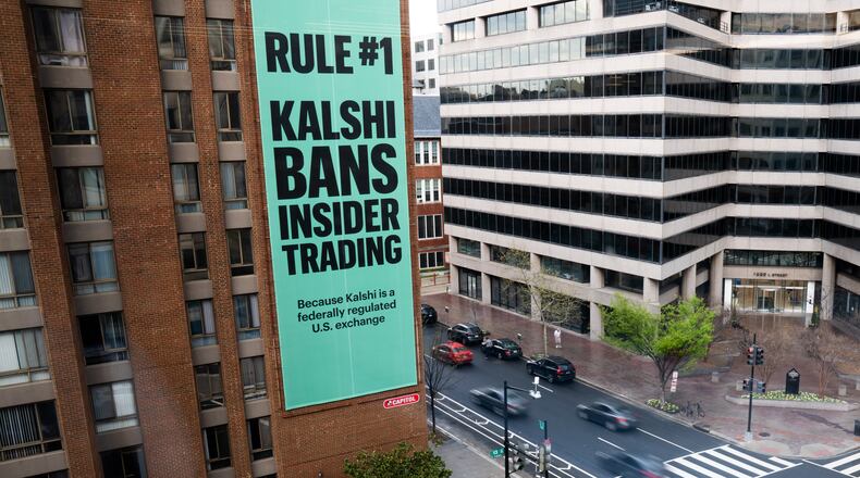FILE - An advertisement for prediction market platform Kalshi hangs at 13th and L Streets in northwest Washington, April 1, 2026. (AP Photo/Allison Robbert, File)
