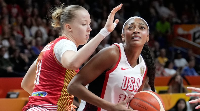 Hungary's Kinga Josepovits guards Angel Reese, of the United States, during the Women's Basketball World Cup quarterfinal match between the United States and Hungary in Berlin, Thursday, Sept. 10, 2026. (AP Photo/Ebrahim Noroozi)