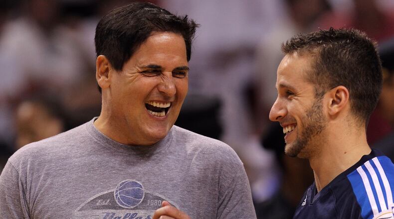 Team owner Mark Cuban (L) has loaned his private jet to Jose Juan Barea of the Dallas Mavericks for hurricane relief in Puerto Rico.
