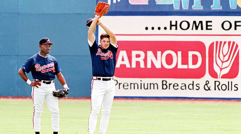 Outfielders Marquis Grissom (left), acquired in a trade with the Montreal Expos, and Ryan Klesko participate in drills during 1995 spring training in West Palm Beach, Fla., after the end of the players’ strike.