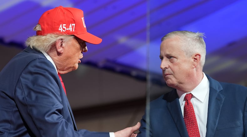 President Donald Trump greets North Carolina Republican U.S. Senate candidate Michael Whatley during a rally at Gastonia Municipal Airport, Wednesday, Sept. 16, 2026, in Gastonia, N.C. (AP Photo/Alex Brandon)