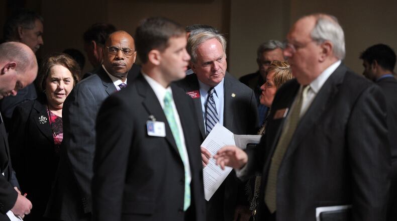Lobbyist bend the ears of lawmakers at the state Capitol Thursday February 7, 2014. BRANT SANDERLIN /BSANDERLIN@AJC.COM