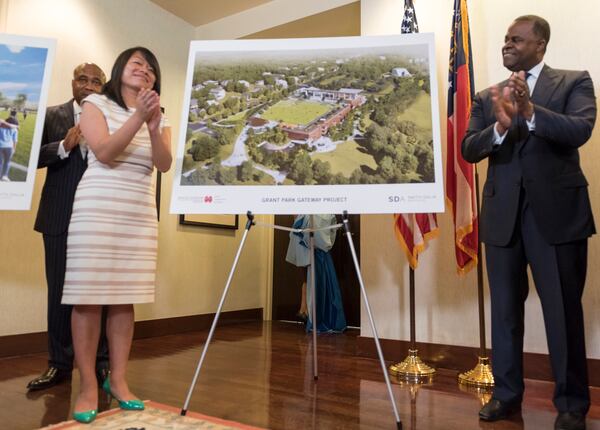April 25, 2017 - Mayor Kasim Reed and Amy Phuong, Commissioner of Department of Parks and Recreation, left, applaud after revealing renderings of the Grant Park Gateway Project during a press conference. The Grant Park Gateway Project aims to alleviate traffic and address a lack of parking. 