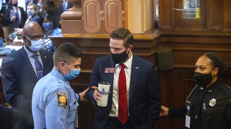 Georgia state Rep. David Clark is removed from the state House chamber by a Georgia state trooper after refusing to take COVID-19 tests in 2021. On Tuesday, he won his GOP primary race in House District 100. MANDATORY CREDIT: NATHAN POSNER