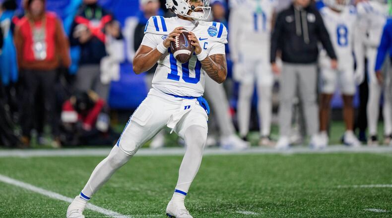 FILE - Duke quarterback Darian Mensah (10) drops back to pass during the Atlantic Coast Conference championship NCAA college football game between Virginia and Duke, Dec. 6, 2025, in Charlotte, N.C. (AP Photo/Jacob Kupferman, File)