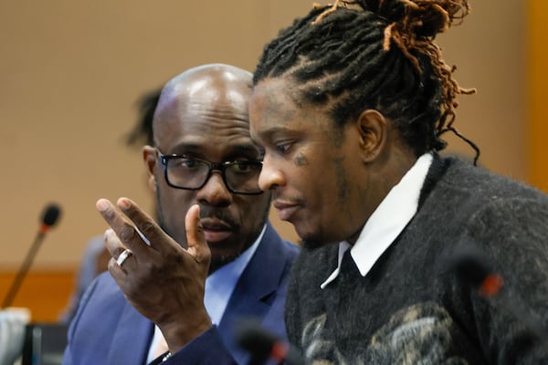Keith Adams (left), who represented rapper Young Thug (right), said DA Fani Willis overuses the RICO statute. (Miguel Martinez/AJC 2023)