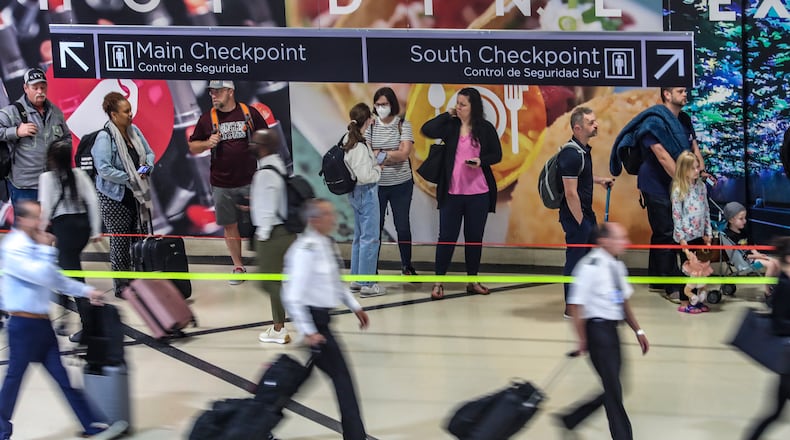 May 25, 2023 Hartsfield-Jackson International Airport: Here travelers surge at the South Terminal inside the airport Thursday morning, May 25, 2023. (John Spink / John.Spink@ajc.com)