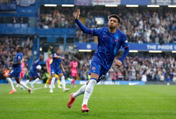 Chelsea's Jadon Sancho celebrates scoring their side's second goal of the game during the English Premier League soccer match between Chelsea and Ipswich Town at Stamford Bridge in London, Sunday April 13, 2025. (Nigel French/PA via AP)