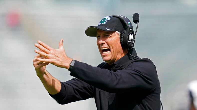 Tulane head coach Willie Fritz calls for a timeout during the first half of an NCAA college football game against Cincinnati in New Orleans, Saturday, Oct. 30, 2021. (AP Photo/Gerald Herbert)