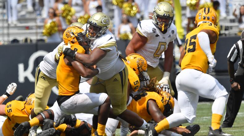 Kennesaw State quarterback Xavier Shepherd is brought down by Georgia Tech defensive lineman Akelo Stone during the second half of an NCAA college football game at Georgia Tech's Bobby Dodd Stadium in Atlanta on Saturday, September 11, 2021. Georgia Tech won 45-17 over Kennesaw State. (Hyosub Shin/AJC)
