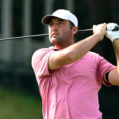 Scottie Scheffler tees off the first playoff hole of the Travelers Championship golf tournament at TPC River Highlands, Monday, June 29, 2026, in Cromwell, Conn. (AP Photo/Jessica Hill)