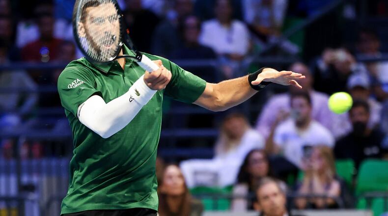 Novak Djokovic of Serbia plays a shot against Lorenzo Musetti of Italy during the ATP 250 tennis tournament final match, in Athens, Greece, Saturday, Nov. 8, 2025. (AP Photo/Yorgos Karahalis)