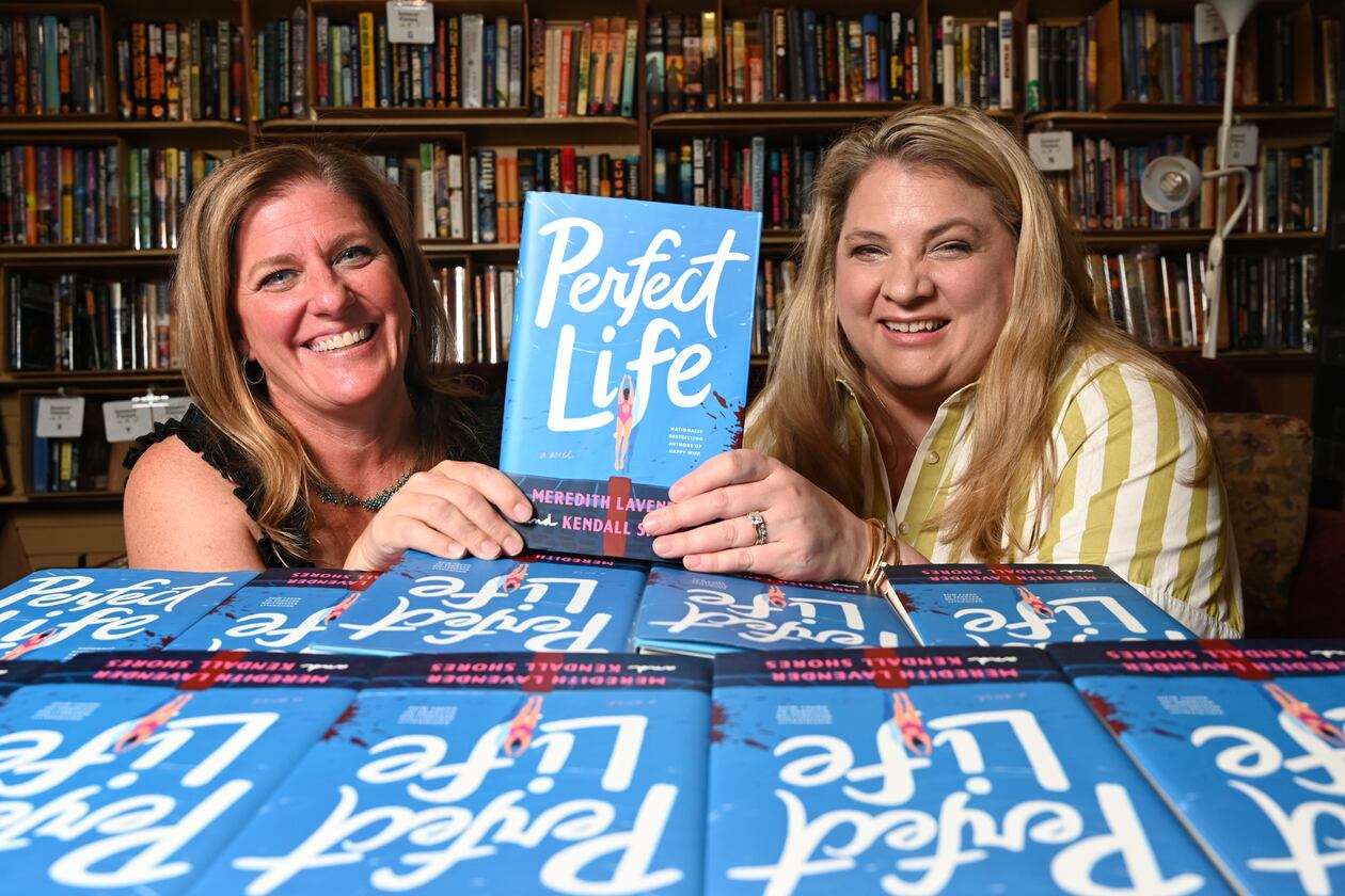 Meredith Lavender (left) and Kendall Shores, became friends first then co-authors. Their latest book, "Perfect Life," published on July 7. (Hyosub Shin/AJC)