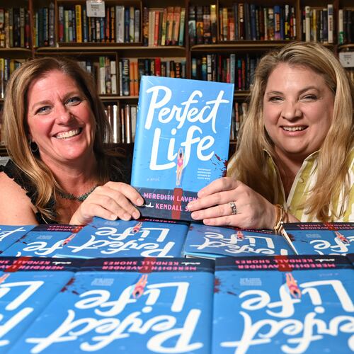 Meredith Lavender, left, and Kendall Shores, became friends first then co-authors. The latest book, "Perfect Life," published on July 7. (Hyosub Shin/AJC)