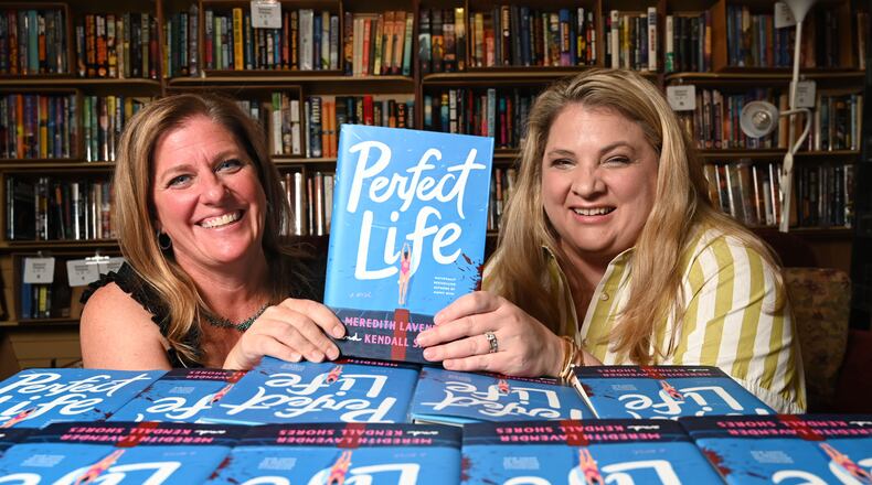 Meredith Lavender, left, and Kendall Shores, became friends first then co-authors. The latest book, "Perfect Life," published on July 7. (Hyosub Shin/AJC)