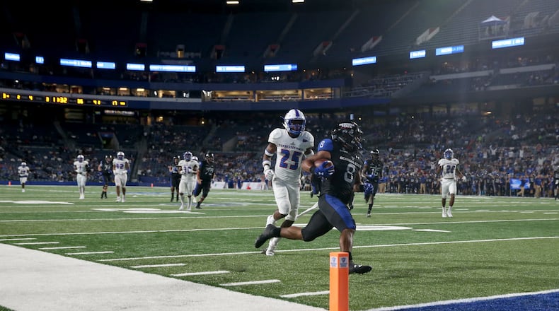 Georgia State Panthers running back Taz Bateman (8) scores a touchdown against Tennessee State Tigers defensive back Vincent Sellers (25) during the second half at Georgia State Stadium Thursday in Atlanta, Ga., August 31, 2017. PHOTO / JASON GETZ