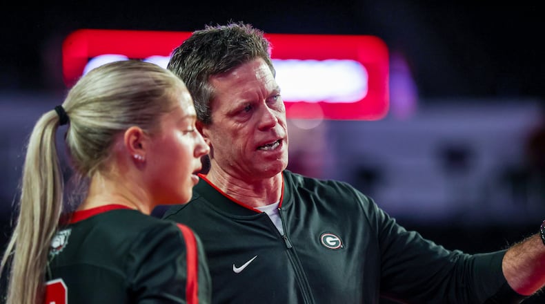 Georgia volleyball coach Tom Black offers instructions to Alexa Fortin during the Bulldogs' match against Ole Miss. Black received a contract extension from UGA. (Photo by Tony Walsh/UGA Athletics)